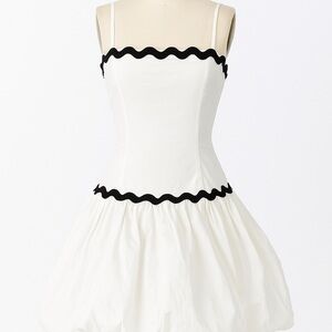 Chic White Mini Dress with Black Trim